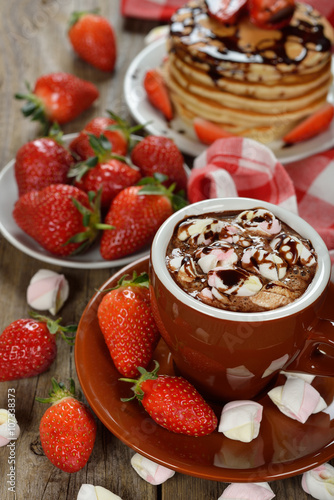 Hot chocolate with marshmallows and strawberries
