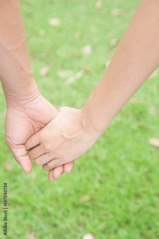 Couple in love holding hands, Friendship and love concept betwee Couple in love holding hands, Friendship and love concept betwee
