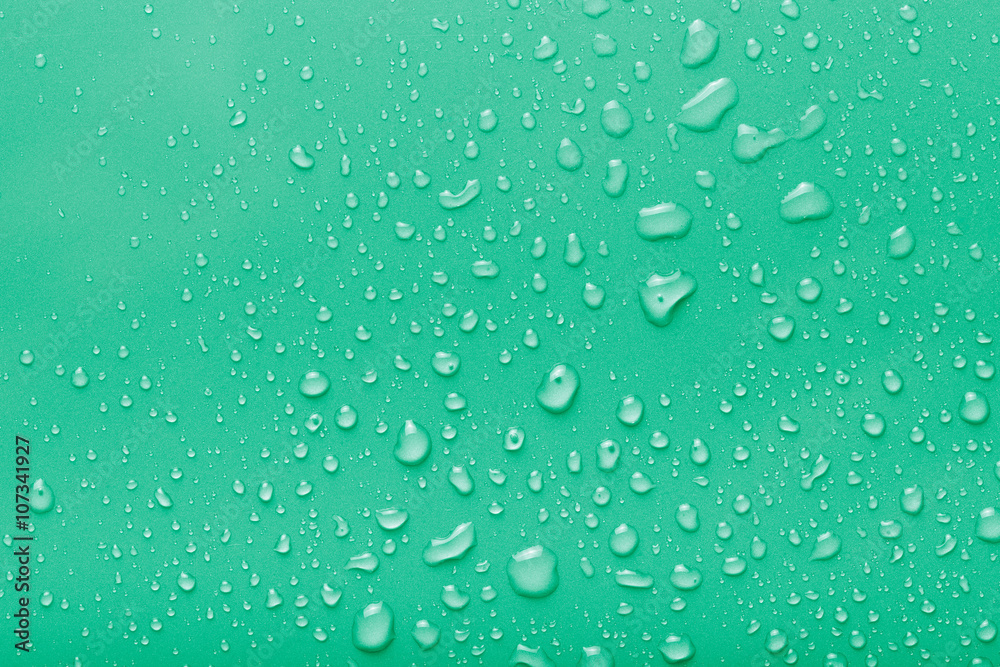 Dops of water on a color background. Green. Toned