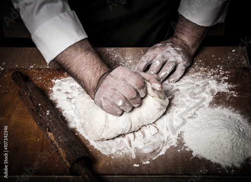 The process of making home bread by male hands. Toned