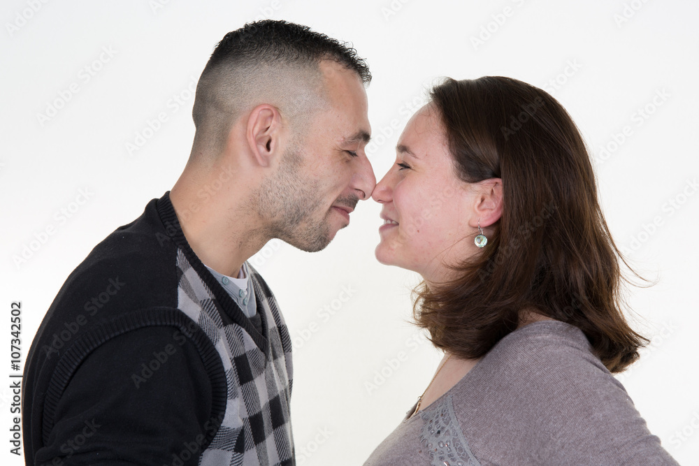 Beautiful affectionate couple smiling - isolated over a white background Beautiful affectionate couple smiling - isolated over a white background
