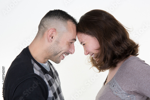 Shot of a passionate young people in love. Isolated over white.