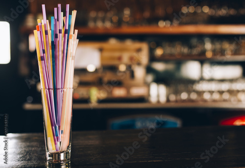 Glasses with straws on the bar photo