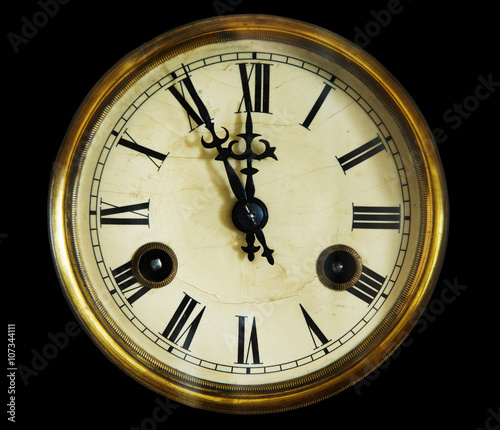 vintage clock face, isolated on a black background.