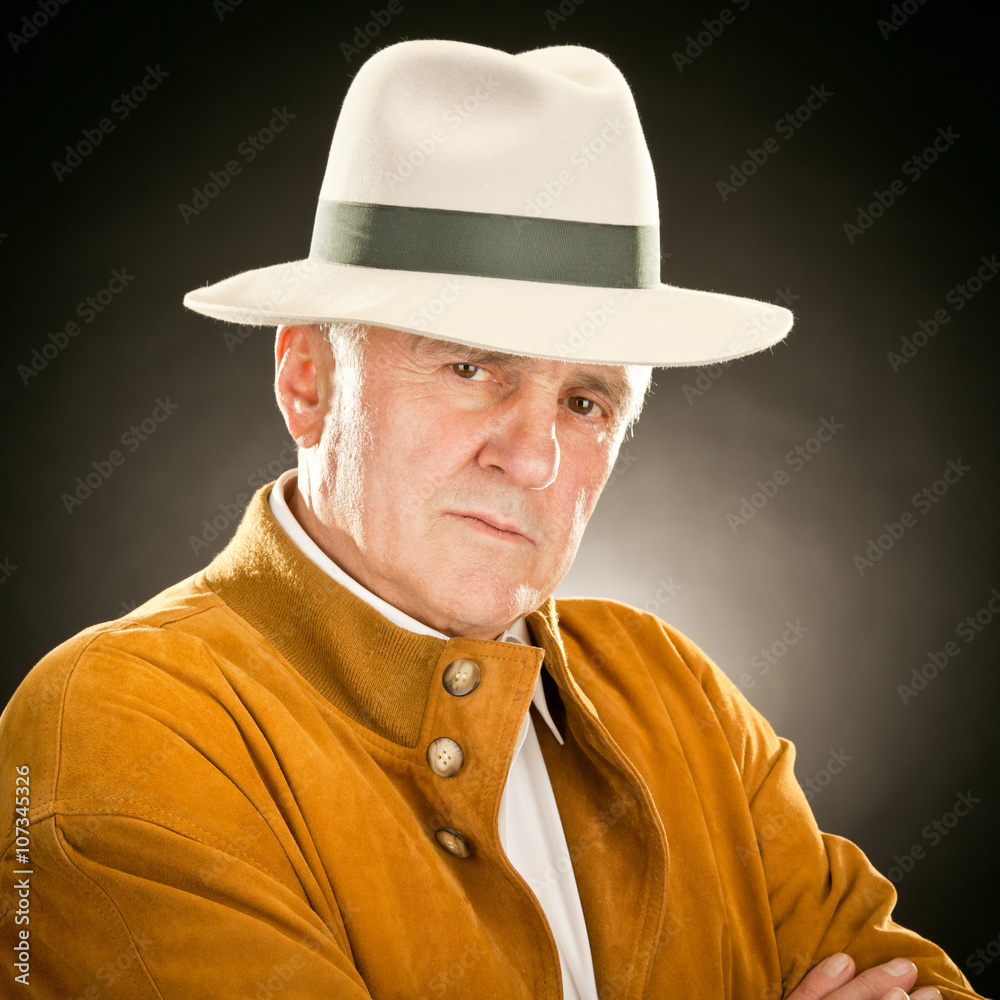 elderly fashion man portrait with hat isolated on black elderly fashion man portrait with hat isolated on black