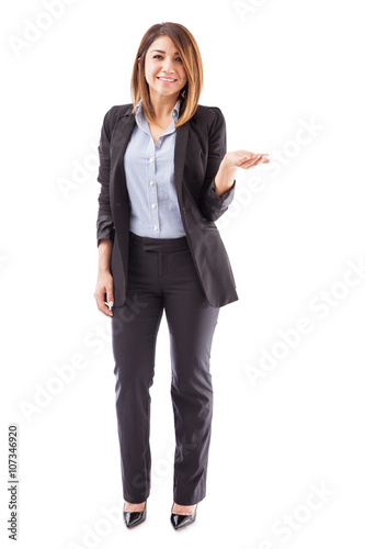 Woman in a suit holding out her hand