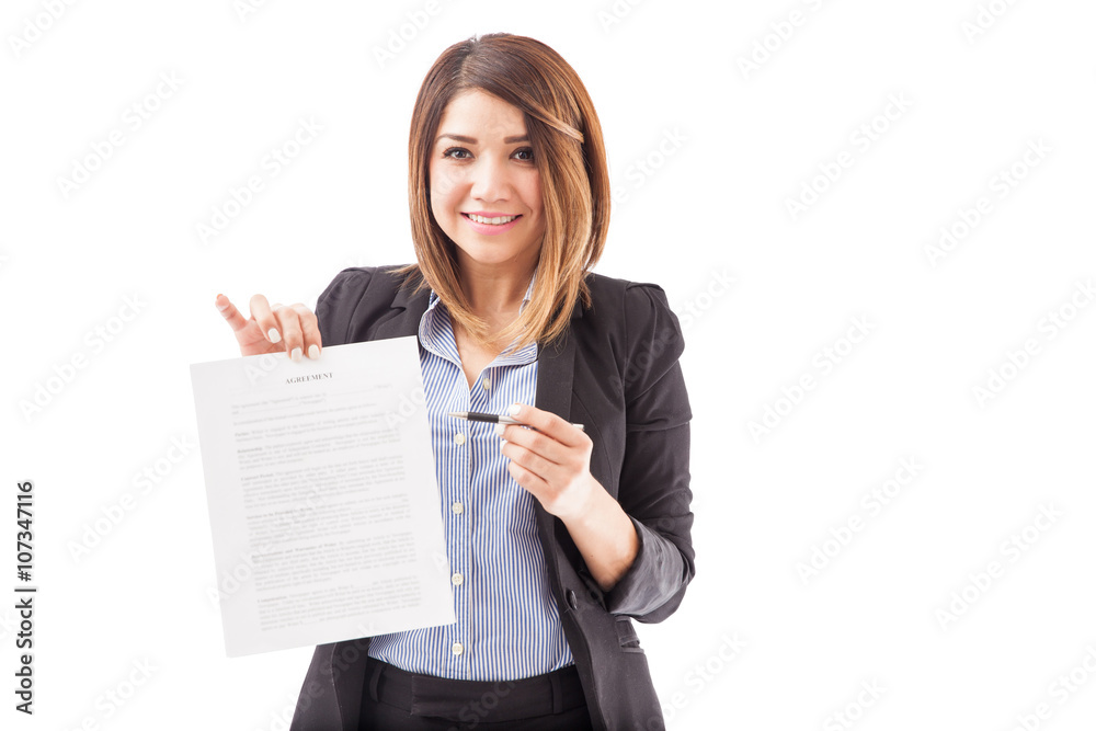 Beautiful Hispanic woman holding a contract Beautiful Hispanic woman holding a contract