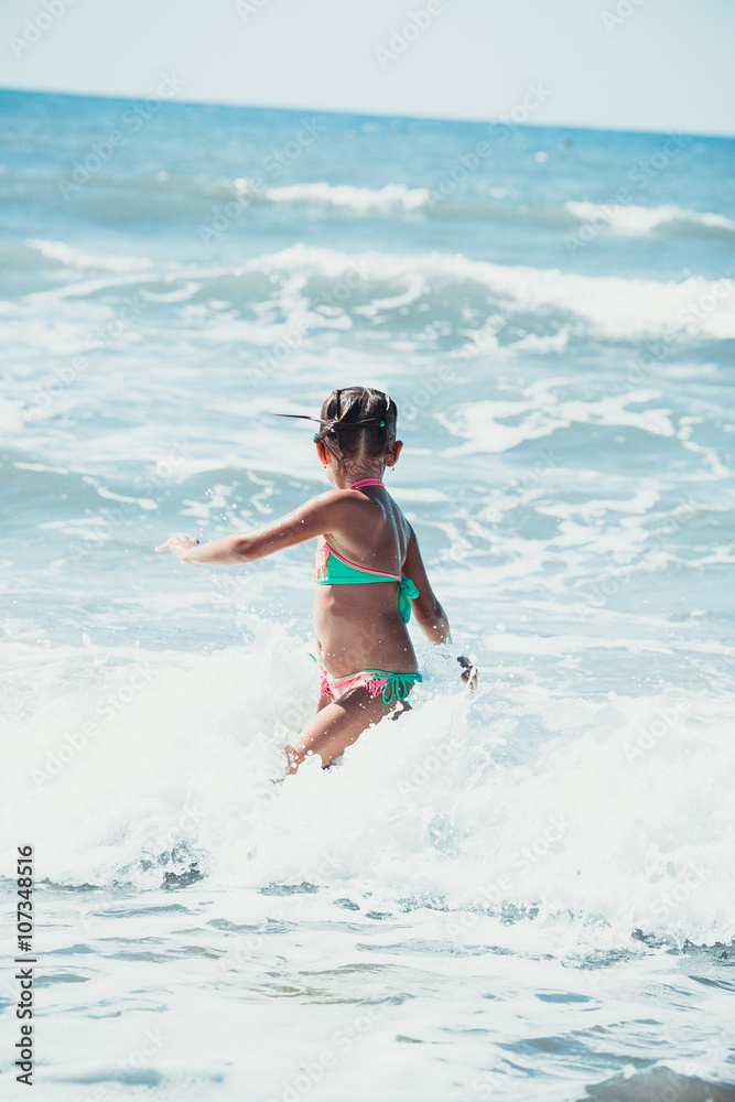 girl having fun by the sea