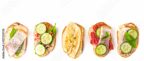 Different tartines on the white background wide screen