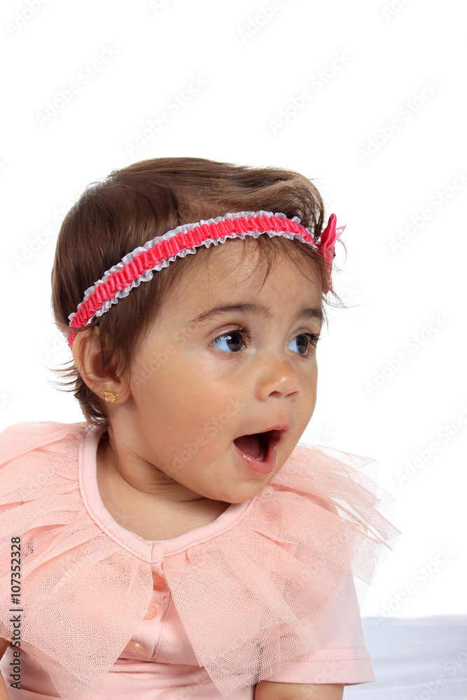 Adorable baby girl on blanket in pampers on a white background Adorable baby girl on blanket in pampers on a white background