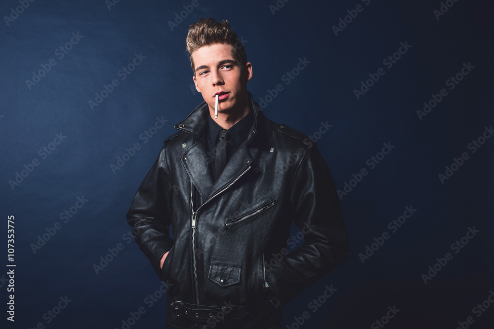 Cigarette smoking retro 50s rock and roll fashion man wearing bl Cigarette smoking retro 50s rock and roll fashion man wearing bl