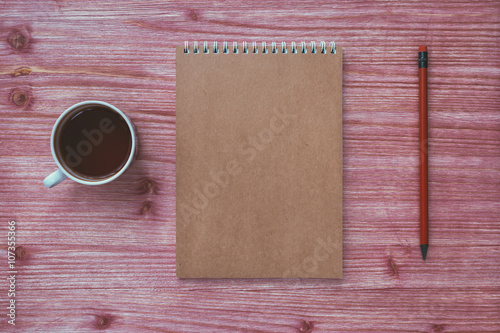 Plakat notebook on a wooden table