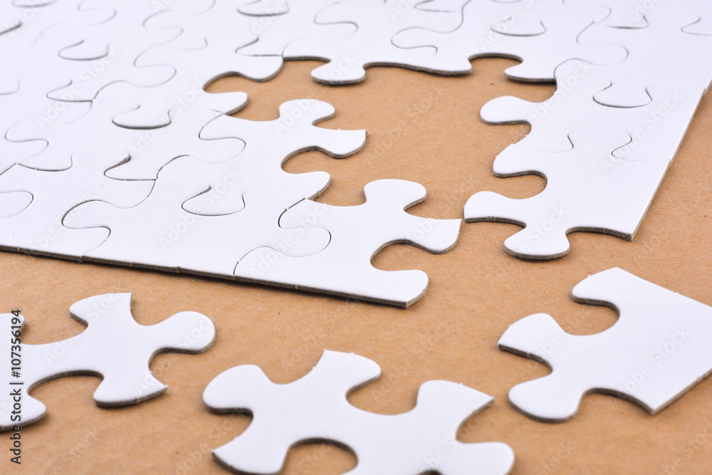 Puzzle on brown background. Team business concept Puzzle on brown background. Team business concept