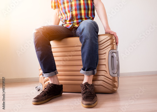 Sitting on baggage