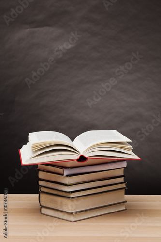Open book on table and gray background and copy space