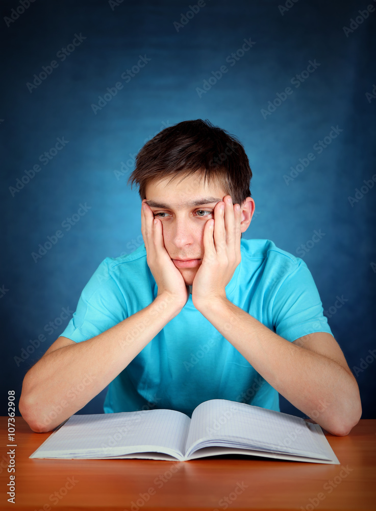 Sad Student with a Book