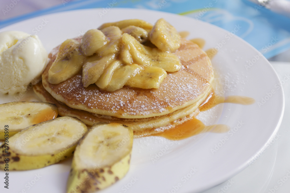 banana cashew pancakes with bananas and salted caramel sauce. the toning. selective focus banana cashew pancakes with bananas and salted caramel sauce. the toning. selective focus