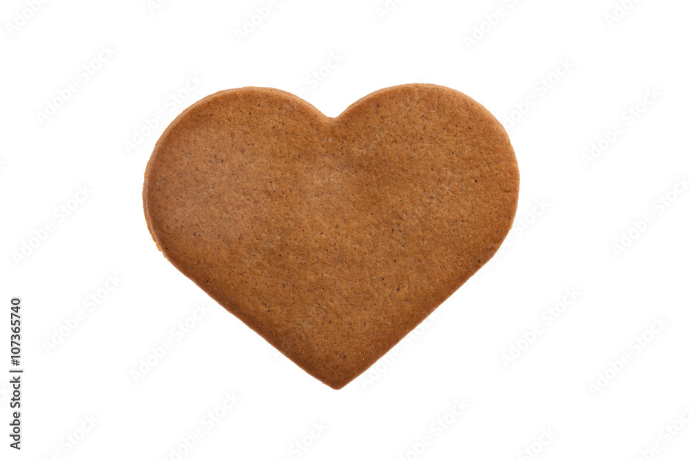 Heart shaped gingerbread cookie on white background