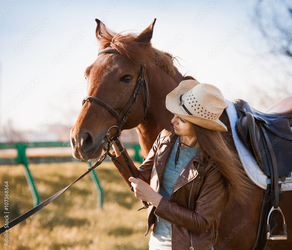 Fototapeta premium Woman and horse. Portrait close up