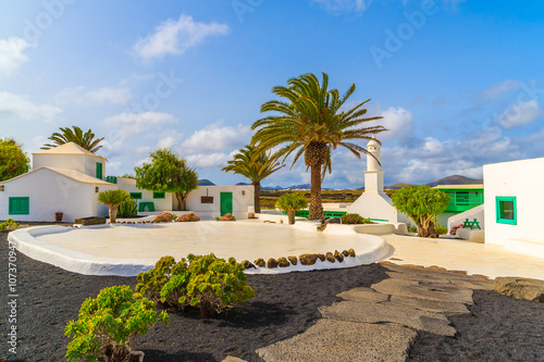 Typical Canarian style buildings and tropical plants, El Campesino village, Lanzarote island, Spain photo