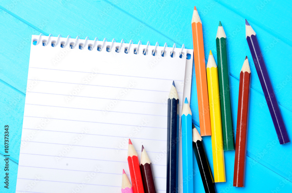 Notebook with colorful pencils Notebook with colorful pencils