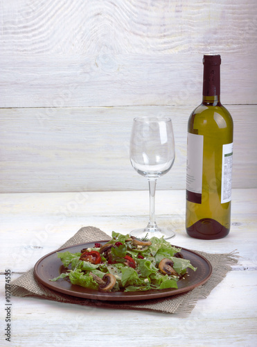 vegetable salad - cold appetizer of fried mushrooms with lettuce and tomatoes