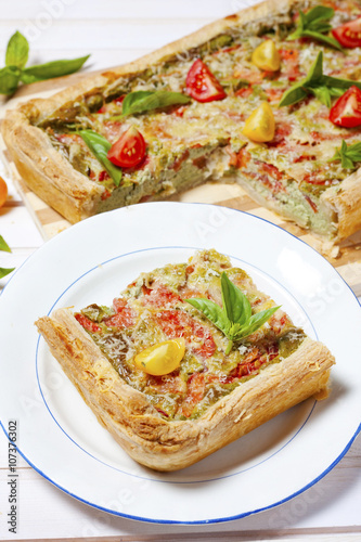 Pie with cheese, tomatoes, herbs and spices