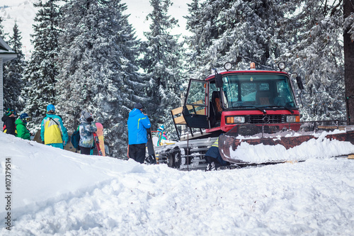 a crowd of young people on a snowy mountain