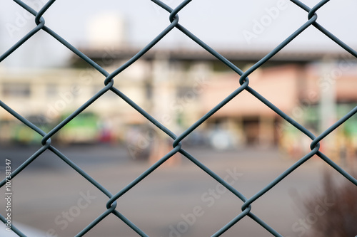 Steel Grating grid on blur city background