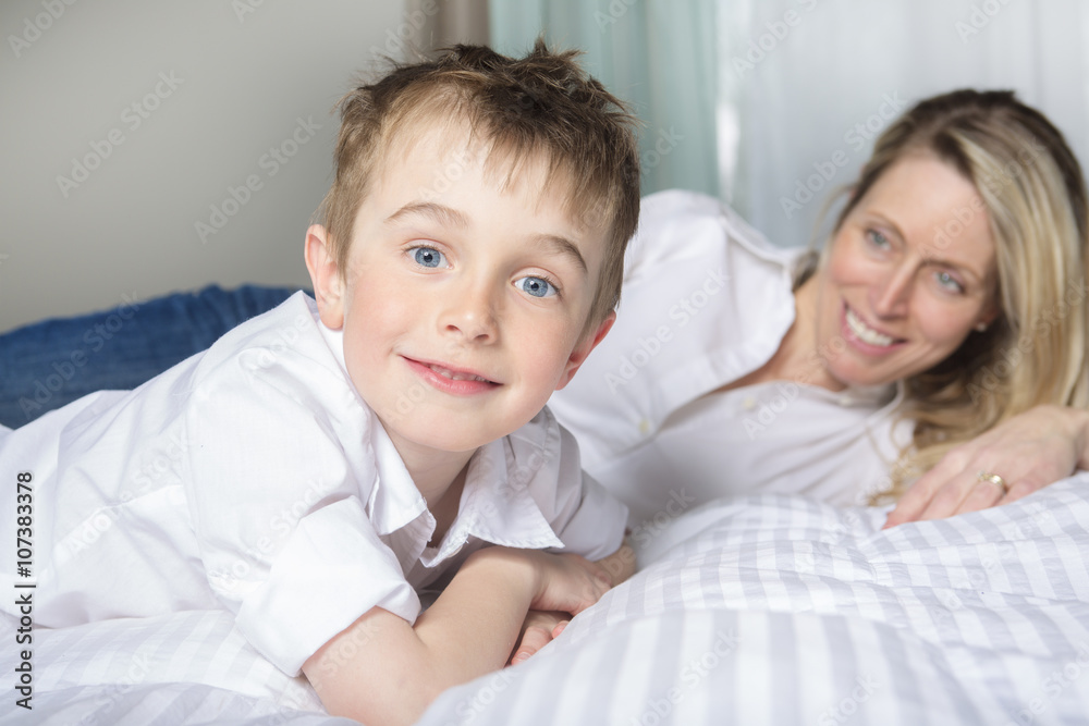 Mother And Son Relaxing Together In Bed Mother And Son Relaxing Together In Bed