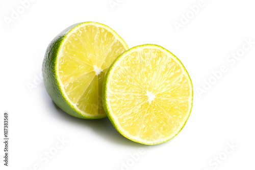 Sliced fresh limes on on white, DOF