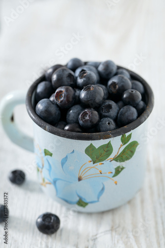 blueberry on wooden surface
