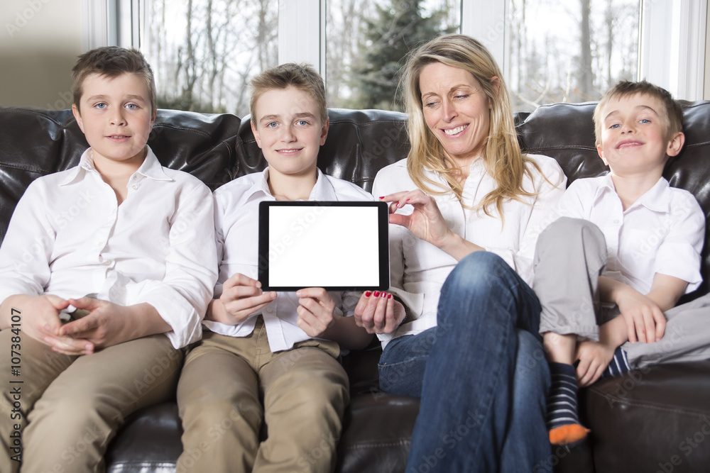 attractive happy, family of mother, son sitting on sofa attractive happy, family of mother, son sitting on sofa