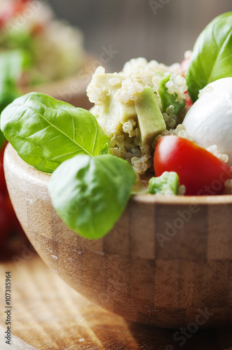 Vegetarian salad with quinoa, tomato and avocado