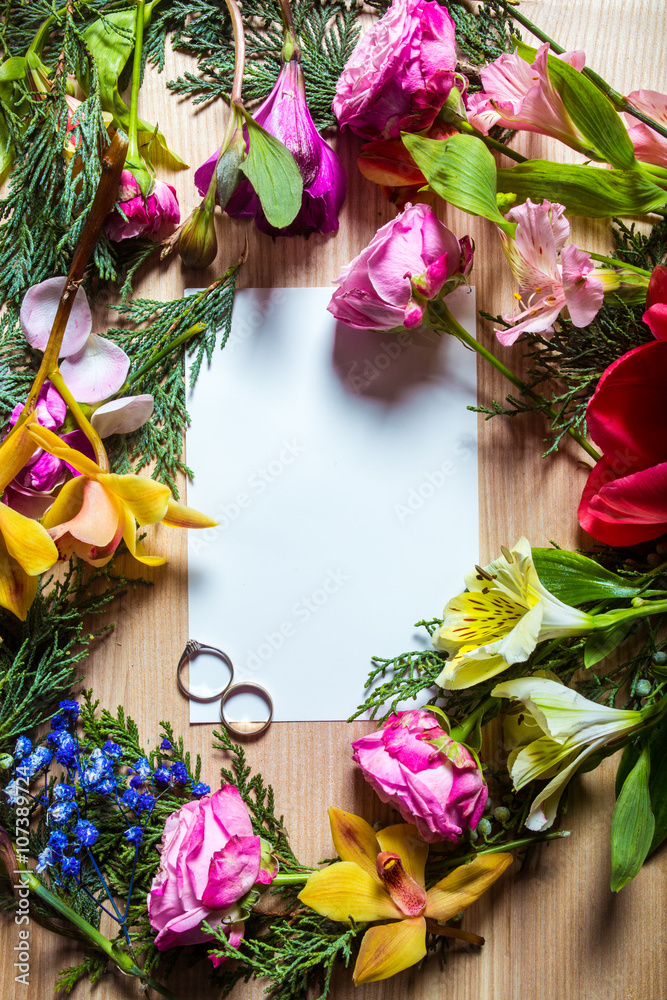 Stylish branding mockup to display your artworks. with flowers and rings Cute vintage mock up on wooden background.