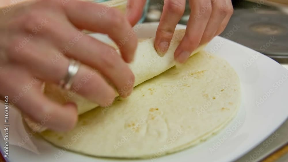 Rolling tortilla with meat close up Rolling tortilla with meat close up