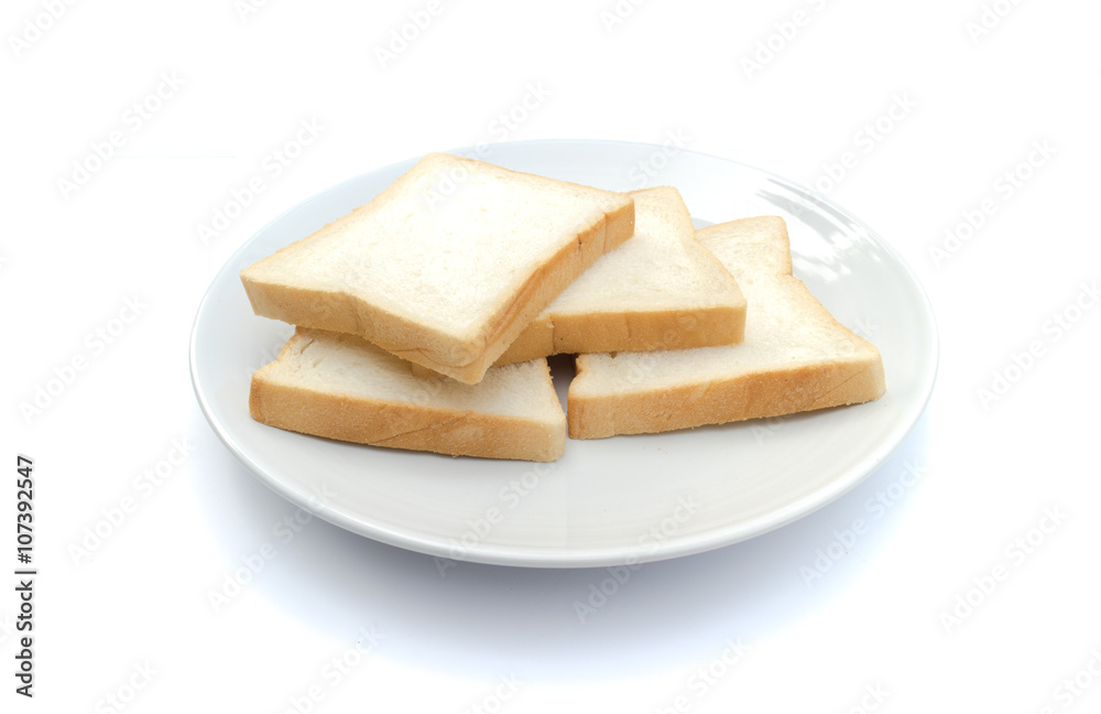 Slice of bread on dish with white background
