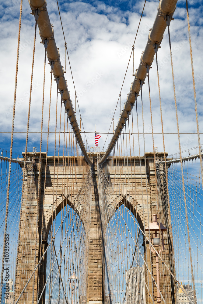 Naklejka premium Upward image of Brooklyn Bridge in New York