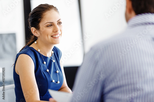 Attractive office worker sitting at desk