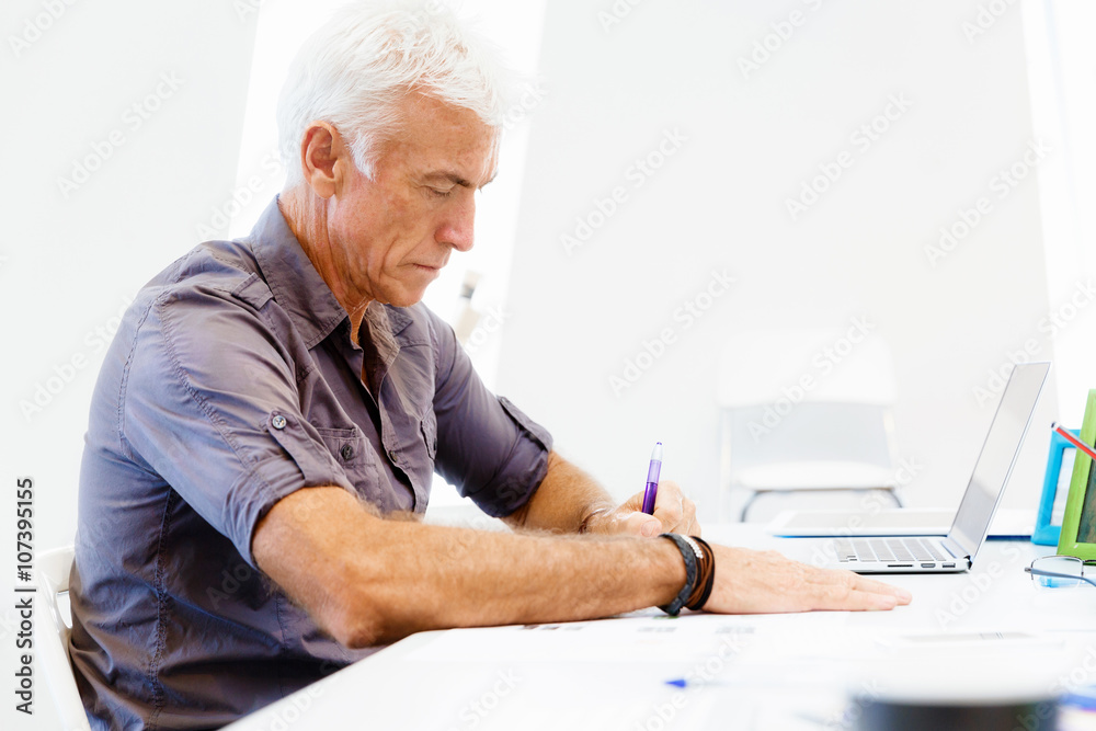 Handsome businessman in office Handsome businessman in office
