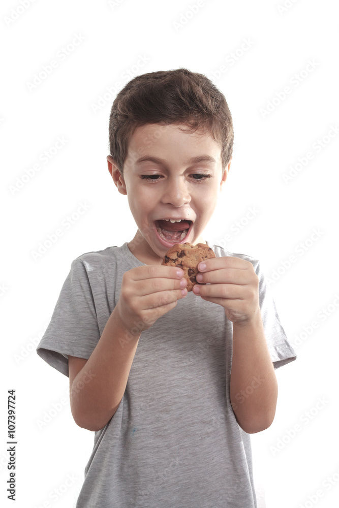 Little boy eating chocolate chip cookie Little boy eating chocolate chip cookie