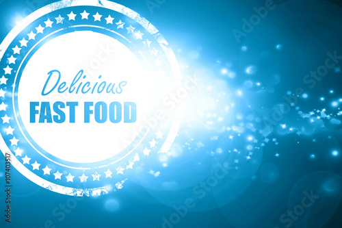 Blue stamp on a glittering background: Delicious fast food