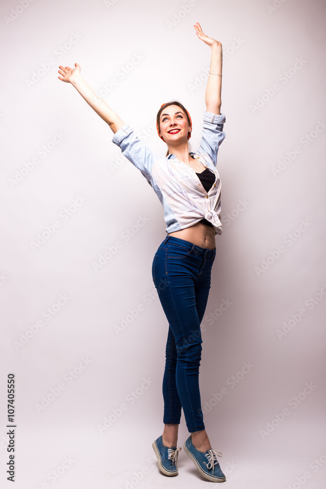 Very happy woman raising her arms and celebrating on white background Very happy woman raising her arms and celebrating on white background