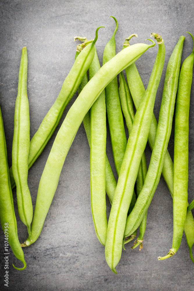 Green beans on a gray background. Green beans on a gray background.
