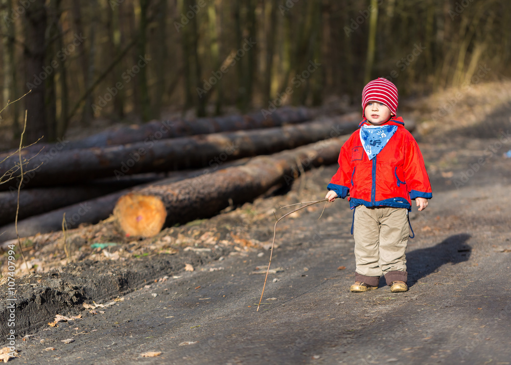 Happy caucasian boy playing outdoor in forest Happy caucasian boy playing outdoor in forest