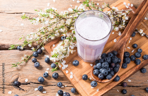 Fresh milk, blueberry drink on wooden table, assorted protein cocktail with fresh fruits.