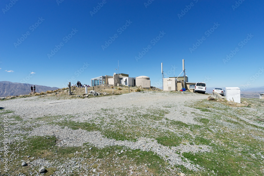 observatory on ground near lake in summer day in new zealand