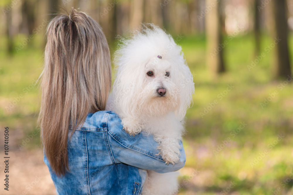 Beauty woman and her dog in the park
