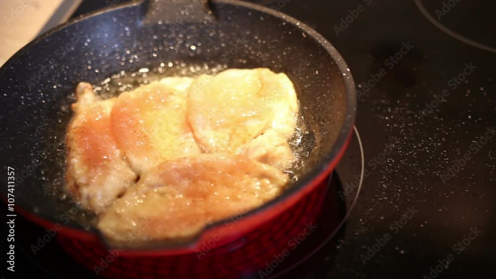 Young woman is cooking in the kitchen