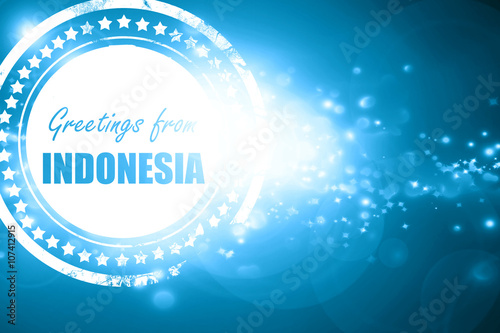 Blue stamp on a glittering background: Greetings from indonesia